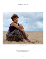 Portrait of a woman seated on the dunes, portrait photography