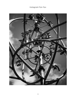 Kinetic metal wind sculpture against the sky, black and white photography