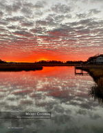 Marsh landscape photography under a fiery sky