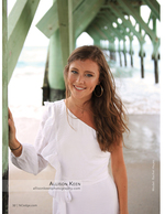 Senior portrait photography beneath the pier