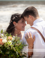 portrait photography of a beachside wedding embrace
