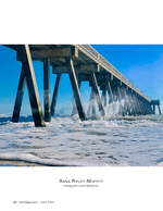 coastal photography of waves crashing under a pier