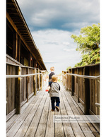 Children portrait photography running on a boardwalk