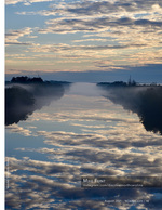 landscape photography of a misty canal reflection