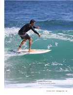 Surfer action photography carving a wave