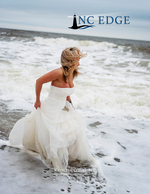 Bridal portrait photography running into the surf