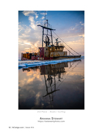 Grounded fishing trawler coastal photography at sunset