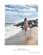 Portrait photography by a rock jetty in a pink dress